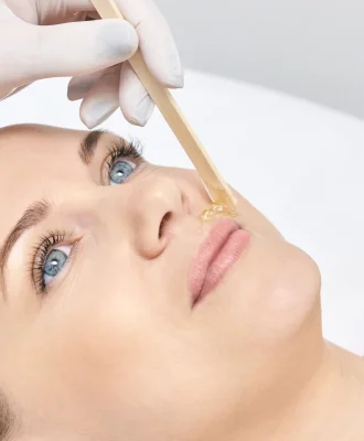 female-caucasian-adult-receiving-facial-waxing-tre-2026-01-11-11-01-26-utc