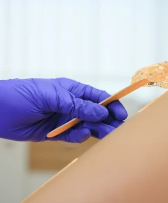 woman-having-hair-removal-procedure-on-leg-with-su-2026-01-08-08-05-17-utc